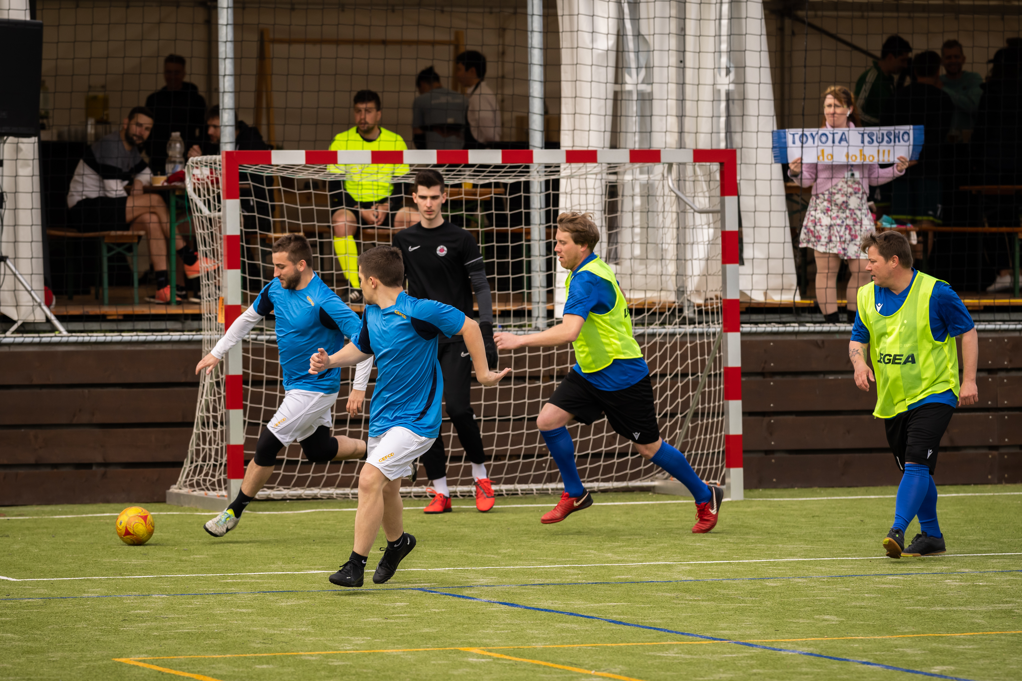 football players in blue and yellow shirts